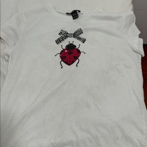 White T-Shirt with Red Ladybug Design